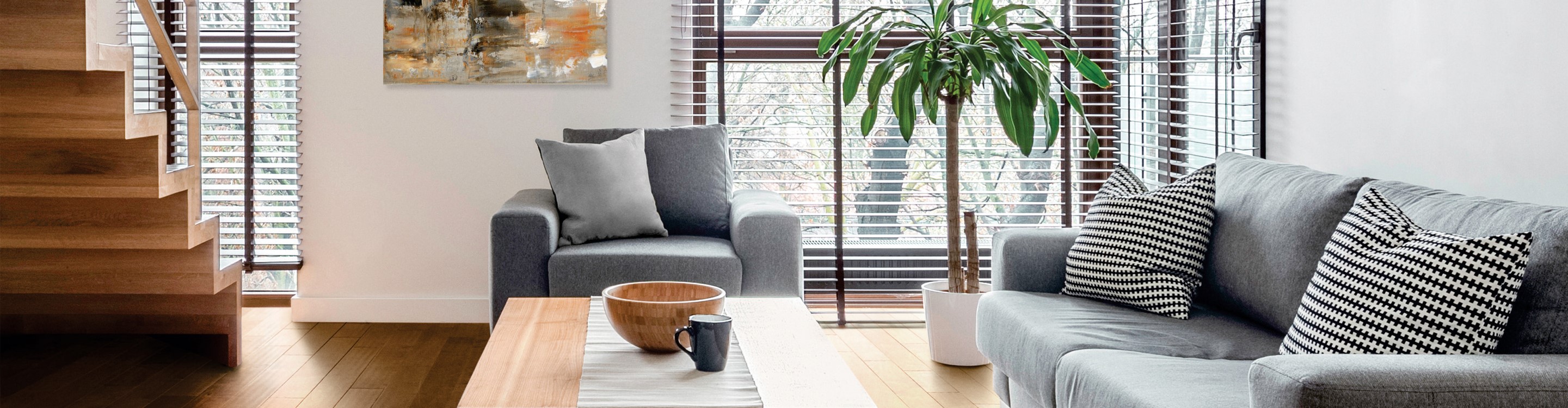 living room with grey furniture and blinds